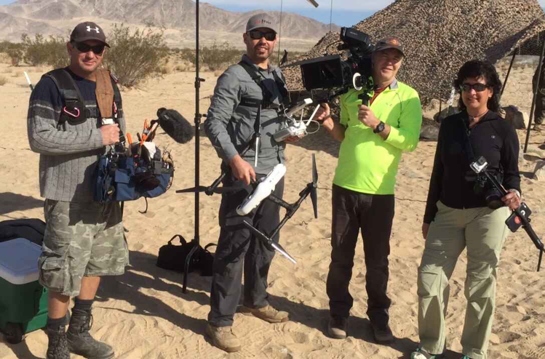 Nutan Chada (right), executive producer of the DLA Video Production Team, leads a contract crew on the “set” of Exercise Steel Knight, Twentynine Palms, California, for a Logistics On Location video December 2015.