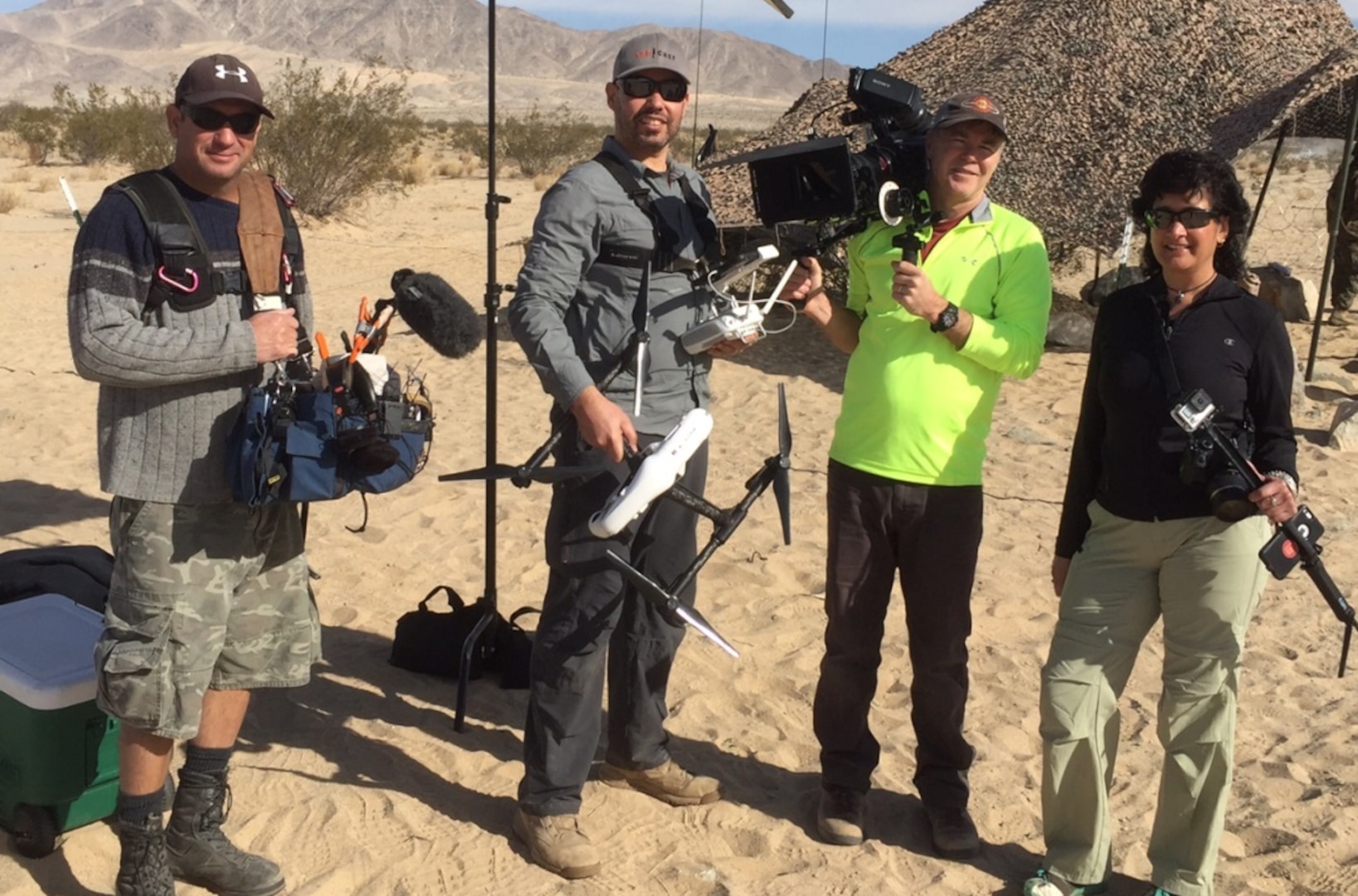 Nutan Chada (right), executive producer of the DLA Video Production Team, leads a contract crew on the “set” of Exercise Steel Knight, Twentynine Palms, California, for a Logistics On Location video December 2015.