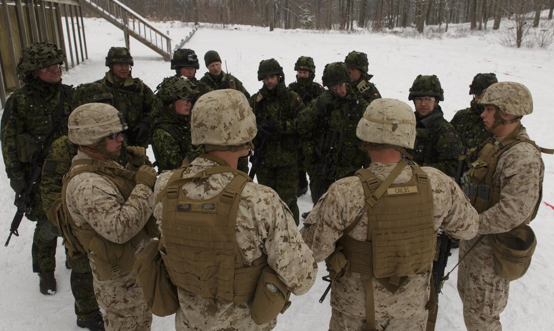 Marines with Company I, 3rd Battalion, 25th Marine Regiment, 4th Marine Division, Marine Forces Reserve, discuss room clearing tactics with soldiers from the Danish Home Guard, April 6, 2016. The Marines joined soldiers with the U.S. Army National Guard and the Danish Home Guard in the bilateral exercise, designed to simulate a joint task force defending key infrastructure in the arctic region. (U.S. Marine Corps photo by Cpl. Ian Leones/Released)