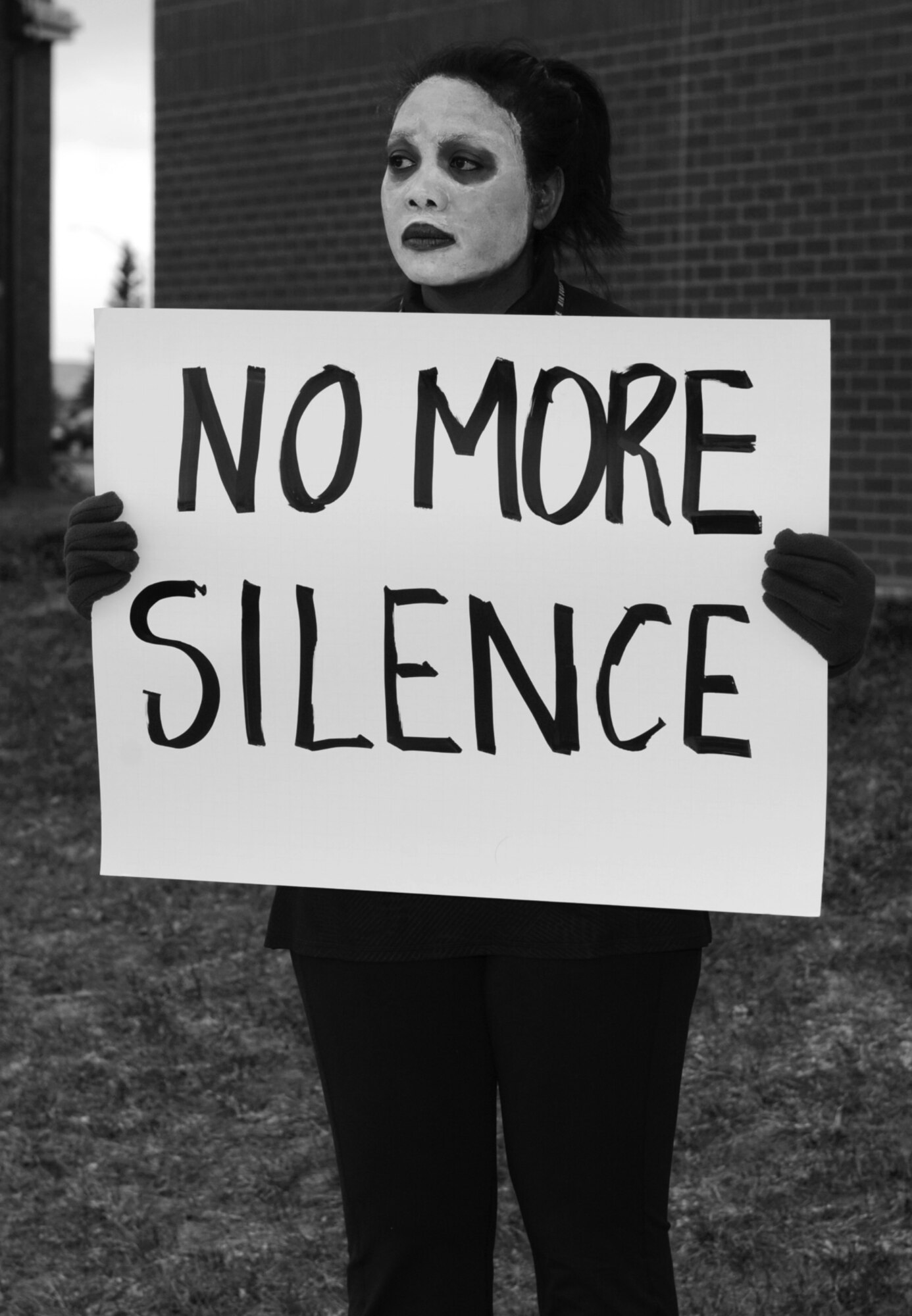 Eunice McFarling, 28th Bomb Wing sexual assault response coordinator, participates in the Sexual Assault Awareness and Prevention Month kickoff event at Ellsworth Air Force Base, S.D., April 1, 2016. Participants in the “living display” were positioned at various locations across Ellsworth, including the dining facility and all three gates, and held signs displaying sexual assault statistics and supportive messages. (U.S. Air Force photo by Airman 1st Class Denise M. Nevins/Released)