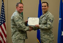 Tech. Sgt. Dean Criswell, 22nd Special Tactics Squadron NCO in charge of rescue operations, receives the Airman’s medal during a ceremony April 8, 2016, at Fairchild Air Force Base, Wash.  Criswell and Maj. Matthew Arnold, 336th Training Group chief of standards evaluations, put their lives in danger to save the lives of the HH-60G Pave Hawk that went down and were able to rescue three Airmen. (U.S. Air Force photo/Airman 1st Class Sean Campbell)