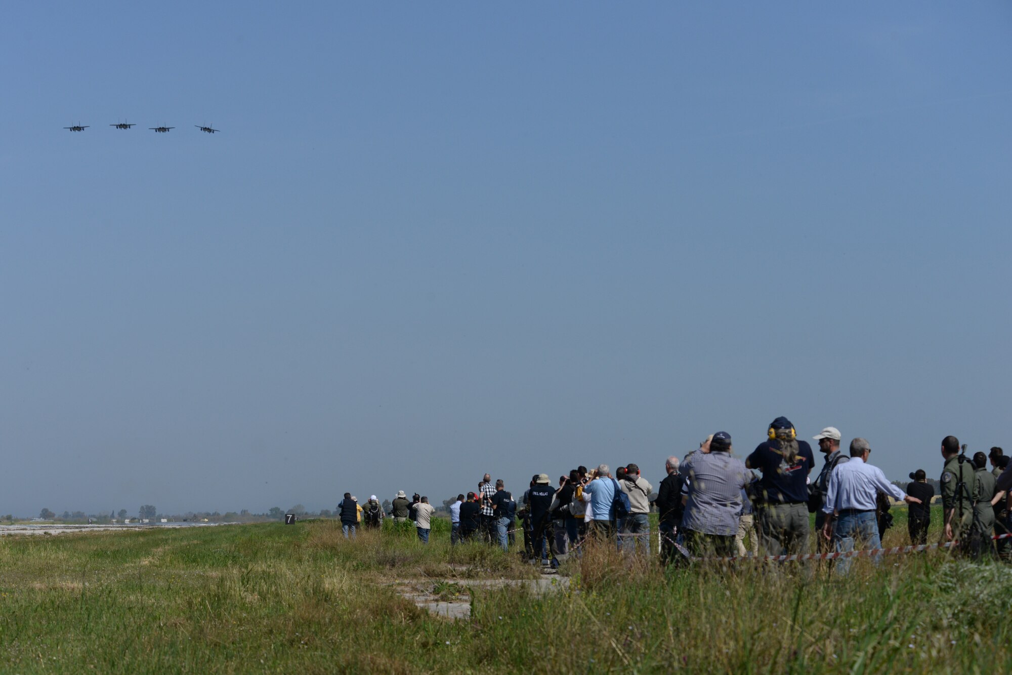 International media members take photos of a formation of U.S. Air Force F-15E Strike Eagles from the 492nd Fighter Squadron, Royal Air Force Lakenheath, England, April 6, 2016, during exercise INIOHOS 16 at Andravida Air Base, Greece. INIOHOS 16 is a Hellenic air force-hosted exercise that enhances interoperability, capabilities, and skills amongst allied and partner air forces in the accomplishment of joint operations and air defenses, in order to maintain joint readiness and reassure regional allies and partners. (U.S. Air Force photo by Tech. Sgt. Eric Burks/Released)