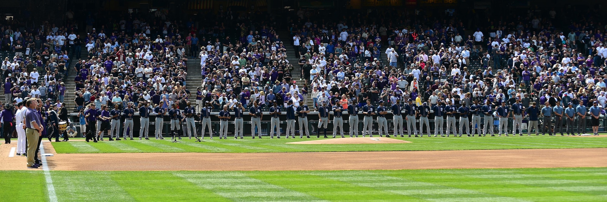 The Colorado Rockies held a military appreciation day April 8, 2016, during pre-game festivities at Coors Field in Denver, Colo. All branches of the military and the community’s civil servants, to include the police department and the county sheriff’s office, attended and participated in the day-long event. The ceremony included a joint color guard and a flag held by those in uniform. (U.S. Air Force photos by Airman 1st Class Gabrielle Spradling/Released)