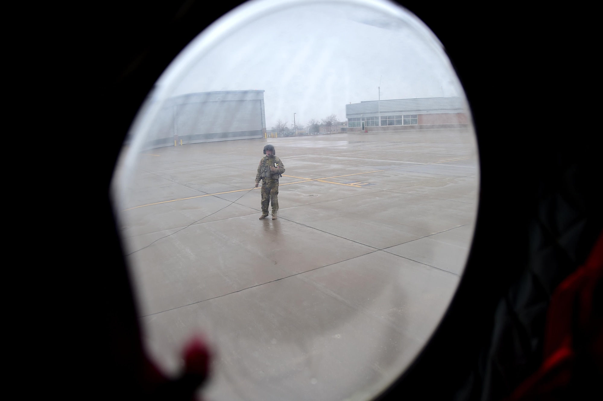 U.S. Army Sgt. 1st Class Guy Morgan, Detachment 1 Bravo standards instructor, checks the exterior of a Ch-47 Chinook helicopter during a pre-flight inspection March 31, 2016, at the Army Aviation Support Facility on Buckley Air Force Base, Colo. Morgan performs a pre-flight inspection, checking to make sure that the aircraft engines are performing properly. (U.S. Air Force photo by Airman 1st Class Gabrielle Spradling/Released)