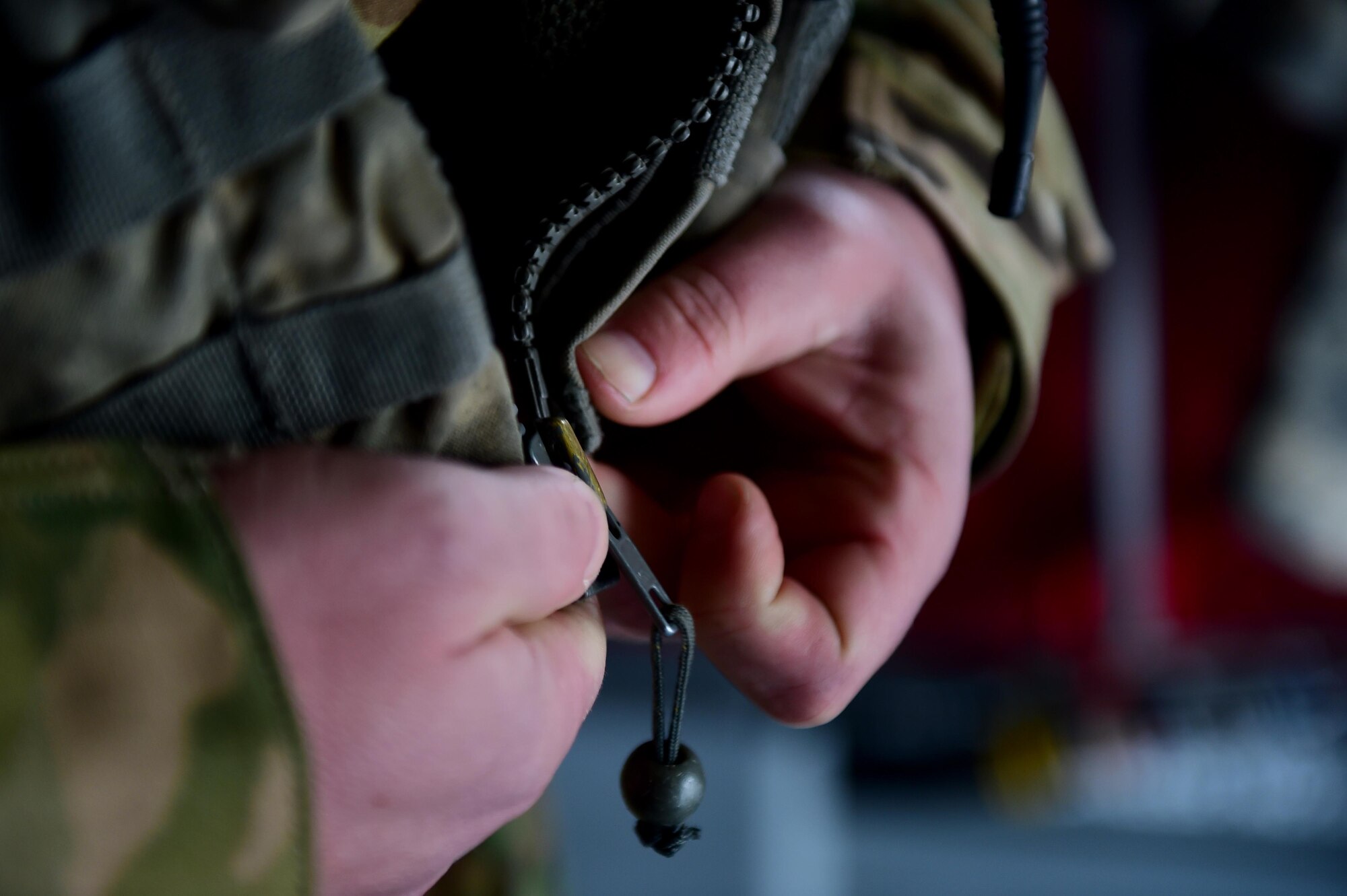 U.S. Army Sgt. 1st Class Guy Morgan, Detachment 1 Bravo standards instructor, zips up his flight vest March 31, 2016, at the Army Aviation Support Facility on Buckley Air Force Base, Colo. The flight vest worn during flight provides the ability to be attached to the aircraft so the flight instructor can easily move around to do any necessary work. (U.S. Air Force photo by Airman 1st Class Gabrielle Spradling/Released)