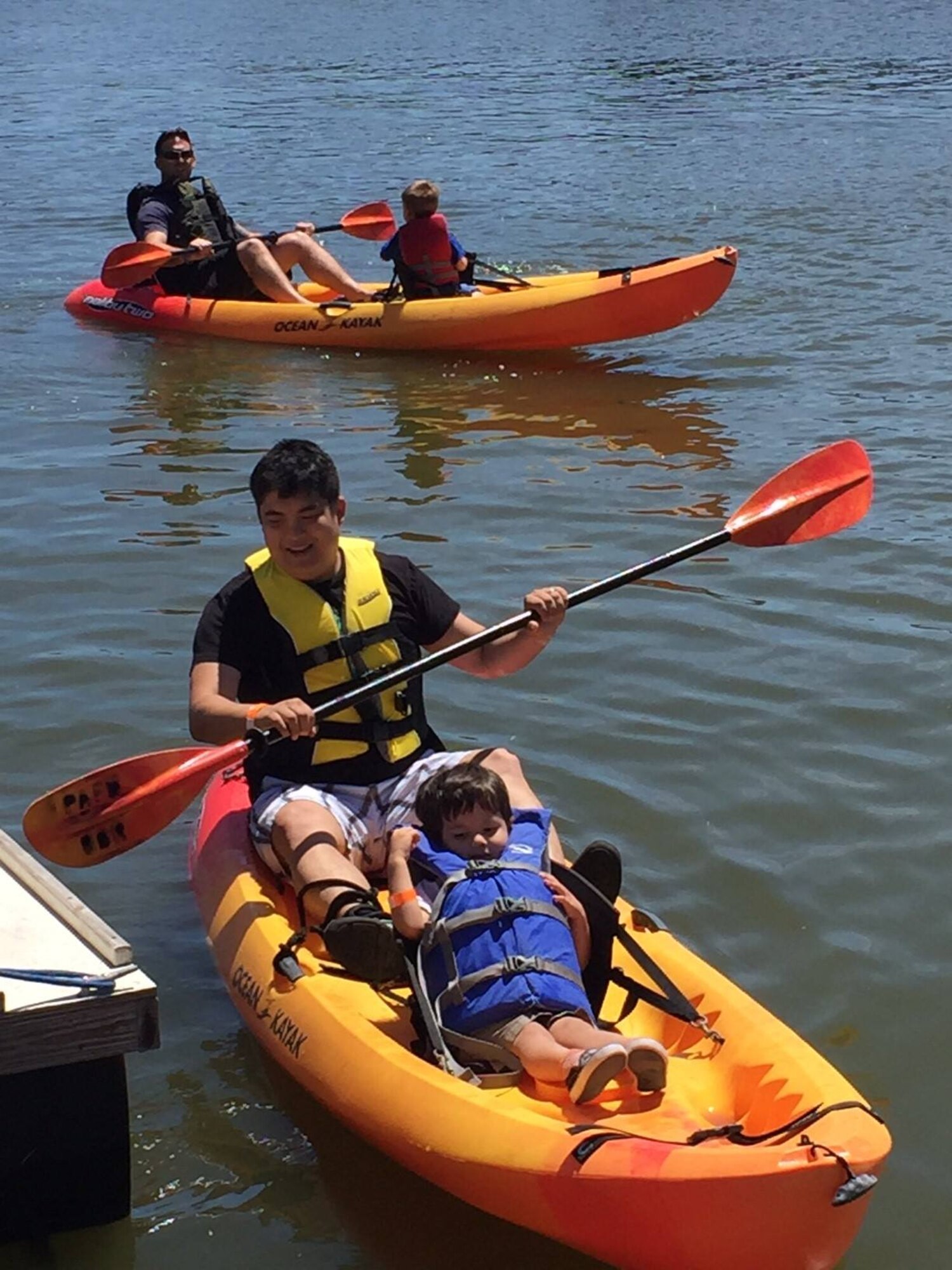 Families navigate the Banana River in kayaks during  the 45th Force Support Squadron's second annual “Play for a Day” event for 45th Space Wing families at Patrick Air Force Base, Fla. April 9. The event kicked off Month of the Military Child and included a variety of activities to introduce the military community to many of the squadron’s services available at Patrick. While families enjoyed giant inflatables, boat rides, cartoon character visits and food at the base marina and golf course, children also had the opportunity to go through a “deployment line.” (Courtesy photo by 45th FSS/released)