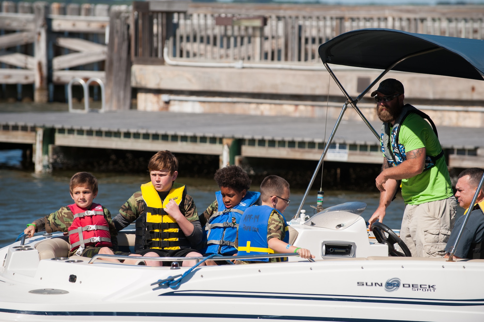 Children deploy from the base marina during “Kids Understanding Deployment Operations,” held in conjunction with Play for a Day at Patrick Air Force Base, Fla, April 9.  KUDOS helped children of military families gain an understanding of what their parents go through before deployment. The 45th Force Support Squadron kicked off “Month of the Military Child with these events for 45th Space Wing families. (U.S. Air Force photo by Benjamin Thacker/Released)