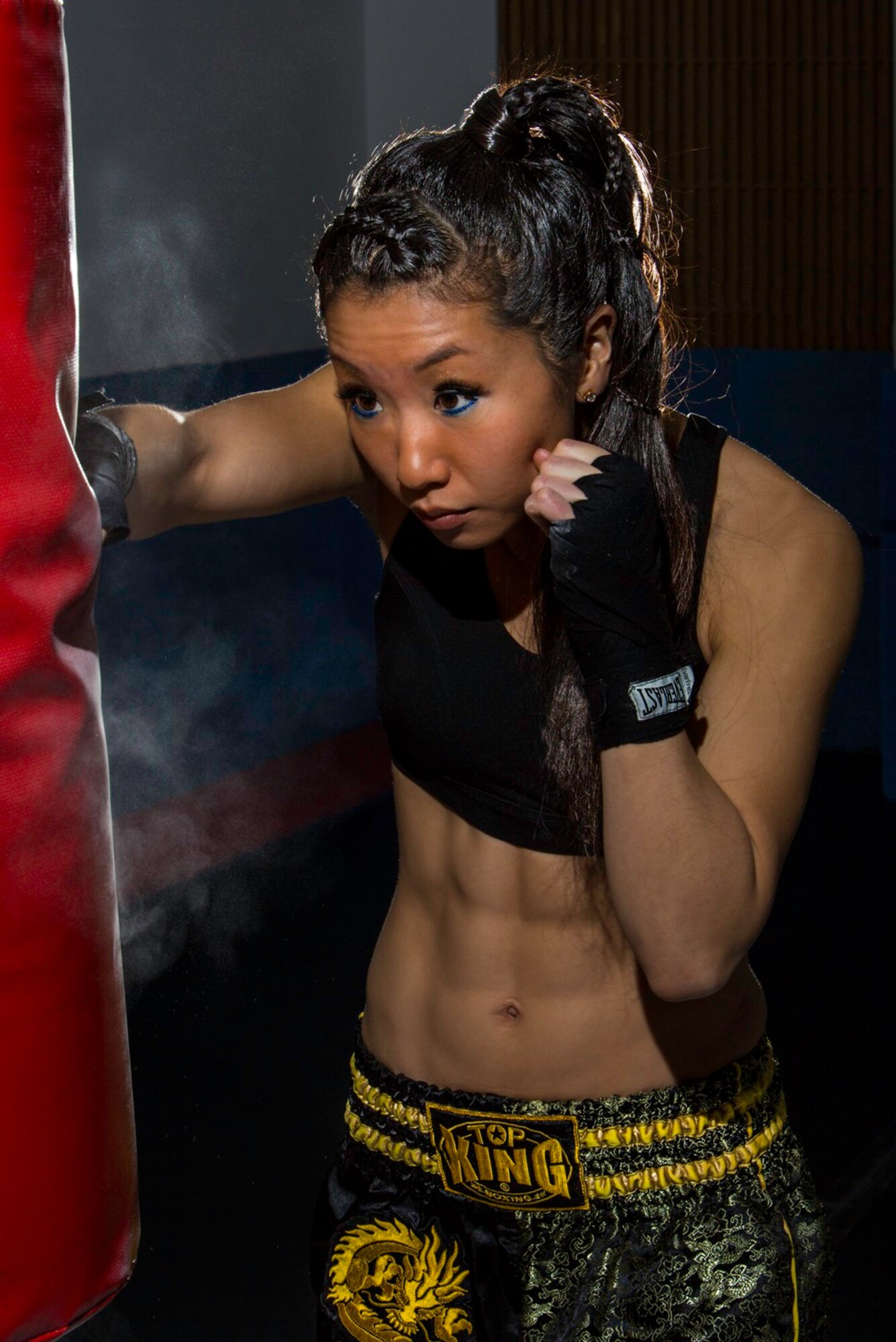 1st Lt. Elizabeth Guidara, 12th Missile Squadron missile combat crew commander, hits a punching bag at the gym at Malmstrom Air Force Base, Mont., Dec. 19, 2015.  Guidara is training to become the first Air Force female officer to go through the Marine Corps Martial Arts Center of Excellence. (U.S. Air Force photo courtesy/Kirk Clark)