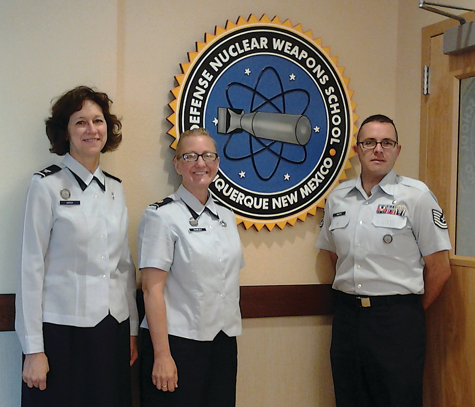 Defense Nuclear Weapons School Reserve component members, from left, Col. Joli Garcia, Maj. Paula Hawley and Tech. Sgt. Nicholas Martin are among the instructions for the Introduction to Radiological and Nuclear Incident Response course. The course teaches military and civilian first responders how to handle nuclear attacks. (Courtesy photo)