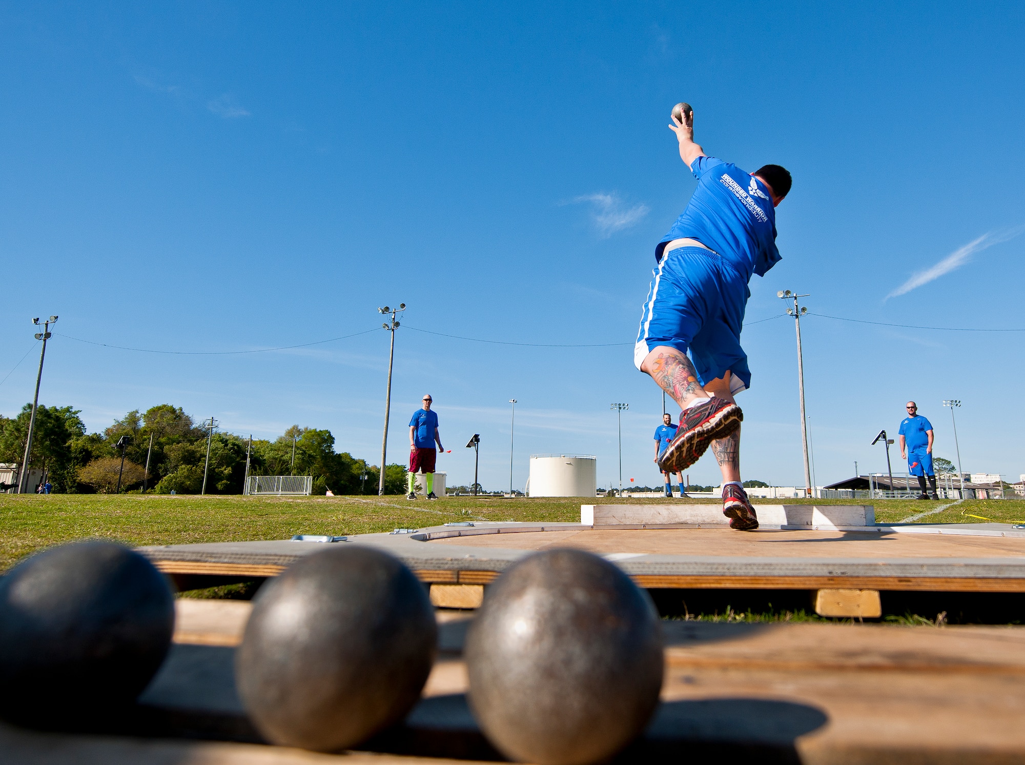 Lucas Purser, a Warrior Games athlete, releases his toss during an afternoon track and field session at the Air Force team’s training camp at Eglin Air Force Base, Fla., April 8.  The base-hosted, week-long Warrior Games training camp was the last team practice session before the yearly competition in June.  (U.S. Air Force photo/Samuel King Jr.)