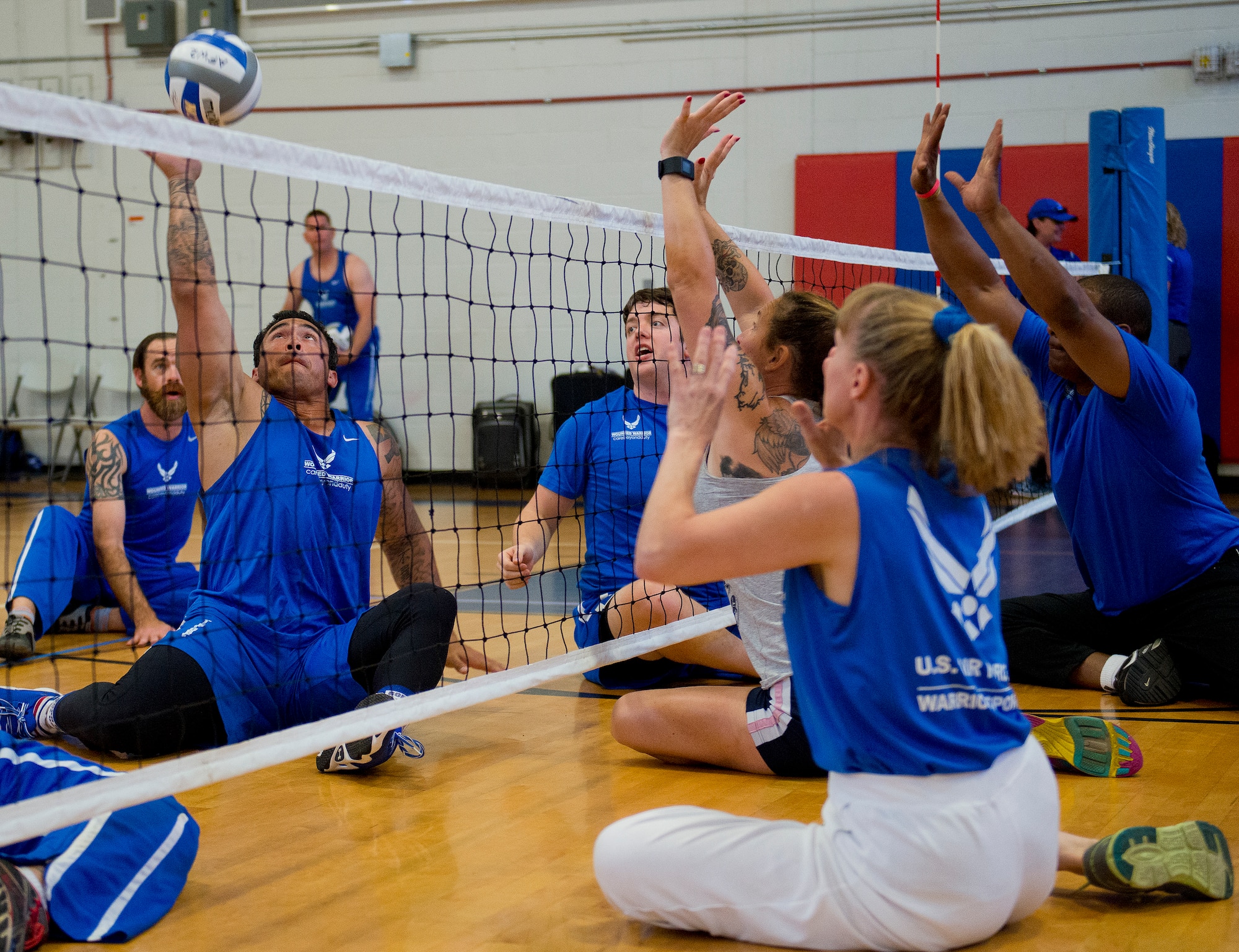 Christopher Ferrell, a Warrior Games athlete, reaches back for a spike during a sitting volleyball game at the Air Force team’s training camp at Eglin Air Force Base, Fla., April 8. The base-hosted, week-long Warrior Games training camp was the last team practice session before the yearly competition in June. (U.S. Air Force photo/Samuel King Jr.)