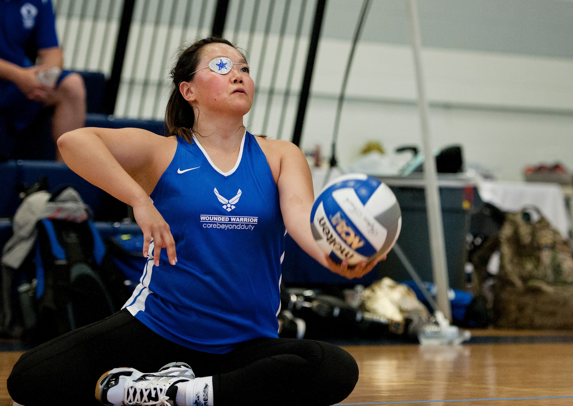 Sarah Frankosky, a Warrior Care athlete, prepares to serve during a sitting volleyball game on the final day of training camp at Eglin Air Force Base, Fla., April 8. The base hosted the week-long Wound Warrior Care event that helps recovering wounded, ill and injured military members through specific hand-on rehabilitative training.  (U.S. Air Force photo/Samuel King Jr.)