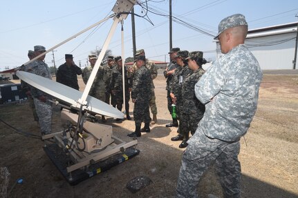 Members of the Honduran Logistics Command (CALFA), are briefed on communication and tracking methods used by ARFOR to monitor vehicles off base when out on missions, at Soto Cano Air Base, Honduras, April 1, 2016. JTF-Bravo hosted the CALFA members to potentially execute combined and joined training. (U.S. Army photo by Martin Chahin/RELEASED)
