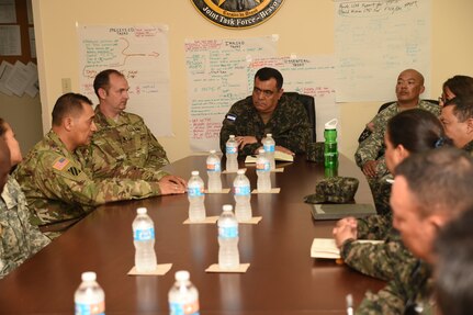 U.S. Army Major Hernando Bello, Army Forces Battalion, provides a brief on the battalion’s mission for Honduran Col. José Antonio Rodriguez Mencia (center), and to members of the Honduran Logistics Command (CALFA), at Soto Cano Air Base, Honduras, April 1, 2016. Col. Rodriguez, new CALFA Commander, and six of his staff visited Soto Cano Air Base to learn about some of the logistical support mechanisms available to ARFOR and Joint Task Force-Bravo.  (U.S. Army photo by Martin Chahin/UNRELEASED)

