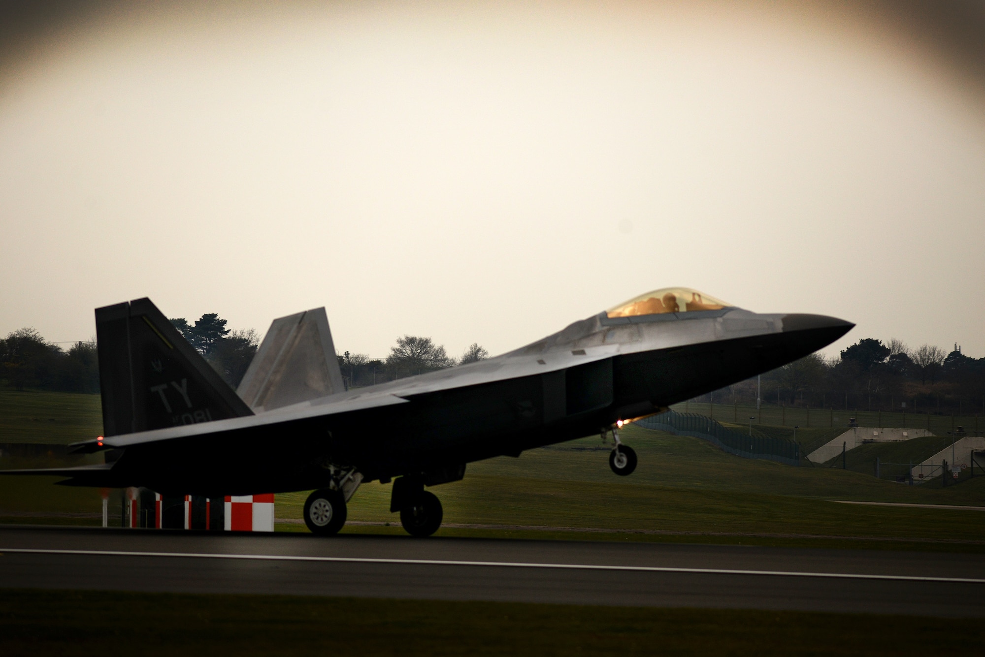 An F-22 Raptor from the 95th Fighter Squadron lands April 11, at Royal Air Force Lakenheath, England. The aircraft arrival marks the second time the U.S. European Command has hosted a deployment of F-22 aircraft in the EUCOM Area of Responsibility.  (U.S. Air Force photo/ Tech. Sgt. Matthew Plew)
