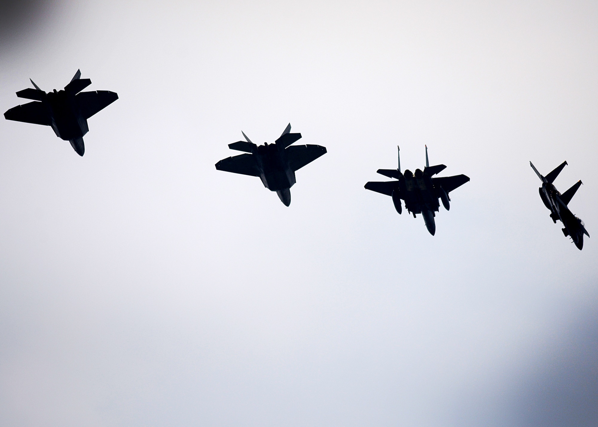 F-22 Raptors from the 95th Fighter Squadron conduct air-to-air training with F-15E Strike Eagles from the 494th Fighter Squadron April 11, at Royal Air Force Lakenheath, England. The training allows the perfect opportunity for the advanced aircraft to train alongside other U.S. Air Force aircraft, joint partners and NATO allies. (U.S. Air Force photo/ Tech. Sgt. Matthew Plew)