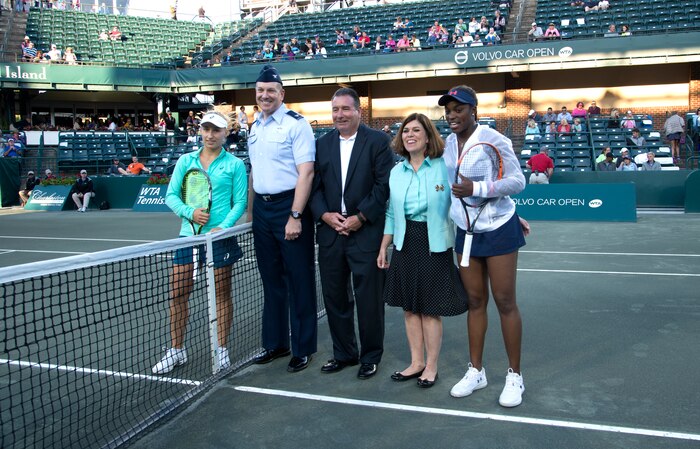 Col. Robert Lyman, Joint Base Charleston commander participates in the opening ceremonies at the Volvo Car Open Tennis Tournament on Military Appreciation Night April 7, 2016, at the Family Circle Cup Stadium on Daniel Island S.C. With Lyman are representatives from the Volvo Car Open staff and professional tennis players Daria Gavrilova (left) and Sloane Stephens (right). (U.S. Air Force Photo/Airman Megan Munoz)