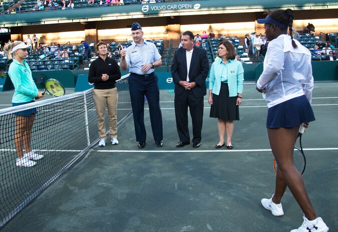 Col. Robert Lyman, Joint Base Charleston commander flips a coin to begin the Volvo Car Open Tennis Tournament on Military Appreciation Night April 7, 2016, at the Volvo Car Open Stadium on Daniel Island, S.C. While hosting more than 70 world-class athletes, the Volvo Car Open is the largest women’s only tennis tournament in the world. (U.S. Air Force Photo/Airman Megan Munoz)