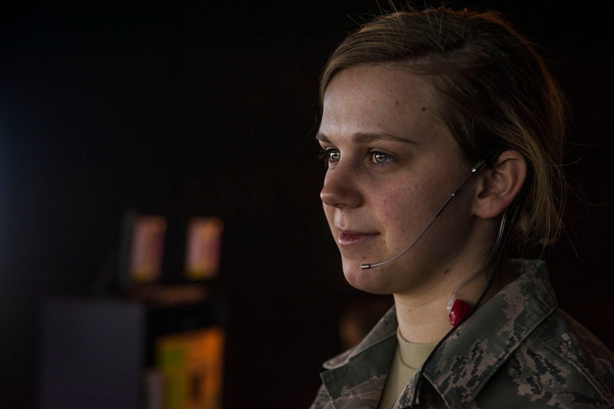 Airman 1st Class Latishia Reinert, a 5th Operations Support Squadron air traffic control journeyman, completes a simulated training exercise at Minot Air Force Base, N.D., April 6, 2016. While using the simulated exercise, Airmen can adjust different elements including the number of aircraft or ground vehicles, runway closures, emergency situations and mishaps. (U.S. Air Force photo/Airman 1st Class Jessica Weissman)