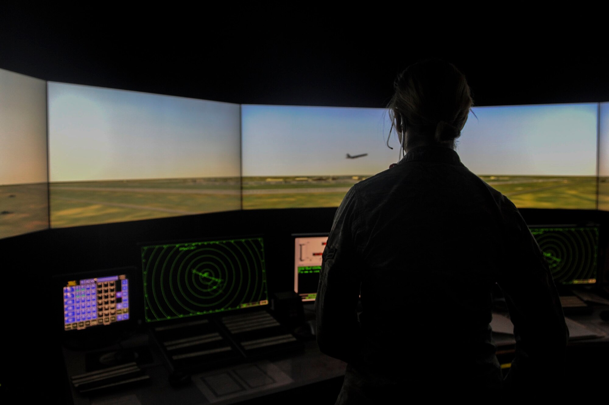 Airman 1st Class Latishia Reinert, a 5th Operations Support Squadron air traffic control journeyman, completes a simulated training exercise at Minot Air Force Base, N.D., April 6, 2016. While using the simulated exercise, Airmen can adjust different elements including the number of aircraft or ground vehicles, runway closures, emergency situations and mishaps. (U.S. Air Force photo/Airman 1st Class Jessica Weissman)