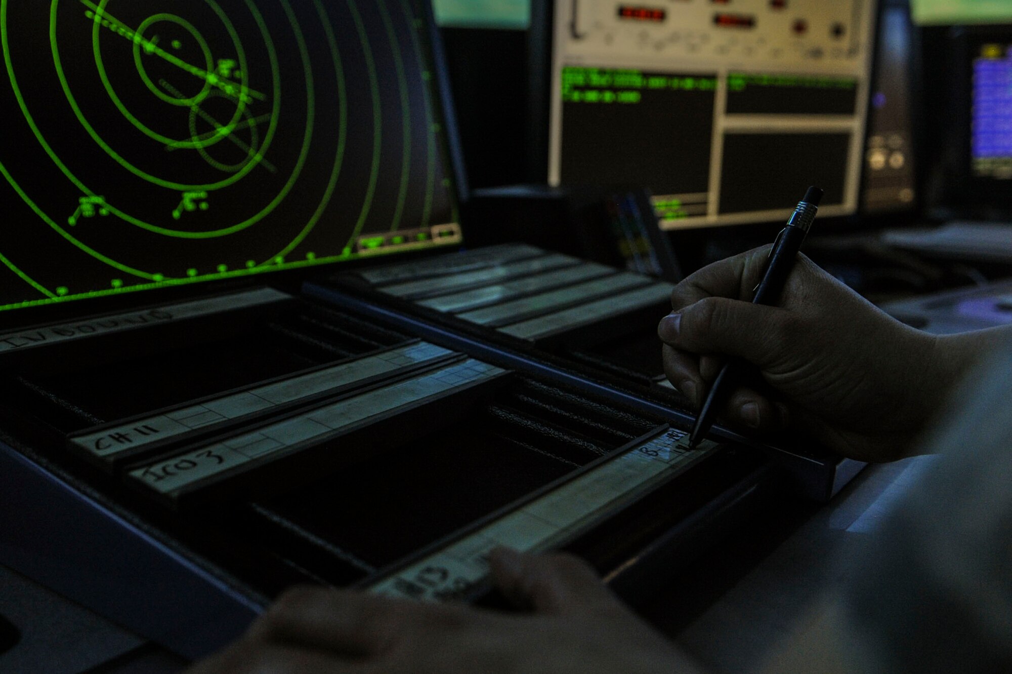 An Airman from the 5th Operations Support Squadron air traffic control completes a simulated training exercise at Minot Air Force Base, N.D., April 6, 2016. While using the simulated exercise, Airmen can adjust different elements including the number of aircraft or ground vehicles, runway closures, emergency situations and mishaps. (U.S. Air Force photo/Airman 1st Class Jessica Weissman)