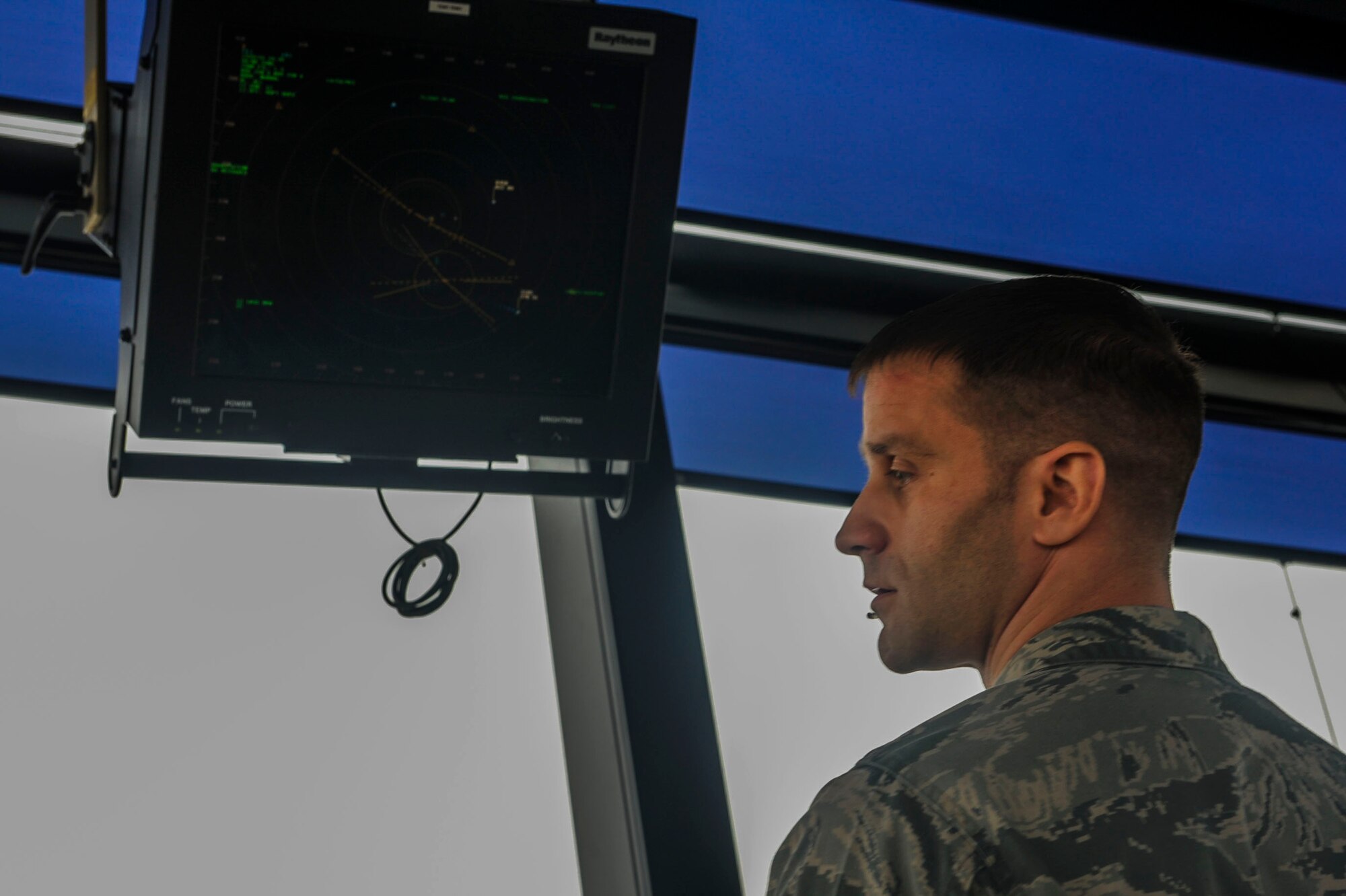 Senior Airman Daniel Wichers, a 5th Operations Support Squadron air traffic control journeyman, monitors the movement of aircraft at Minot Air Force Base, N.D., April 6, 2016. The primary responsibility of controllers is to support the nuclear mission through separation of aircraft and provide expeditious service to Team Minot. (U.S. Air Force photo/Airman 1st Class Jessica Weissman)