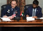 U.S. Air Force Maj. Gen. Clinton E. Crosier, U.S. Strategic Command (USSTRATCOM) director of plans and policy (left), and His Excellency, Dr. Khalifa Al Romaithi, United Arab Emirates Space Agency (UAESA) chairman, sign a memorandum of understanding (MOU) at the Broadmoor Hotel in Colorado Springs, Colo., April 11, 2016. The MOU to share space situational awareness (SSA) services and information, signed during the 32nd Space Symposium, will enhance awareness within the space domain and increase the safety of spaceflight operations for the U.S. and UAE. The UAE joins 10 nations, two intergovernmental organizations, the European Space Agency and the European Organization for the Exploitation of Meteorological Satellites, and more than 50 commercial satellite owner/operator/launchers already participating in SSA data-sharing agreements with USSTRATCOM. SSA data-sharing agreements enhance multinational space cooperation and streamline the process for USSTRATCOM partners to request specific information gathered by USSTRATCOMâ€™s Joint Space Operations Center at Vandenberg Air Force Base, Calif. One of nine DoD unified combatant commands, USSTRATCOM has global strategic missions, assigned through the Unified Command Plan, which include strategic deterrence; space operations; cyberspace operations; joint electronic warfare; global strike; missile defense; intelligence, surveillance and reconnaissance; combating weapons of mass destruction; and analysis and targeting. (U.S. Air Force photo by Senior Airman William Branch)