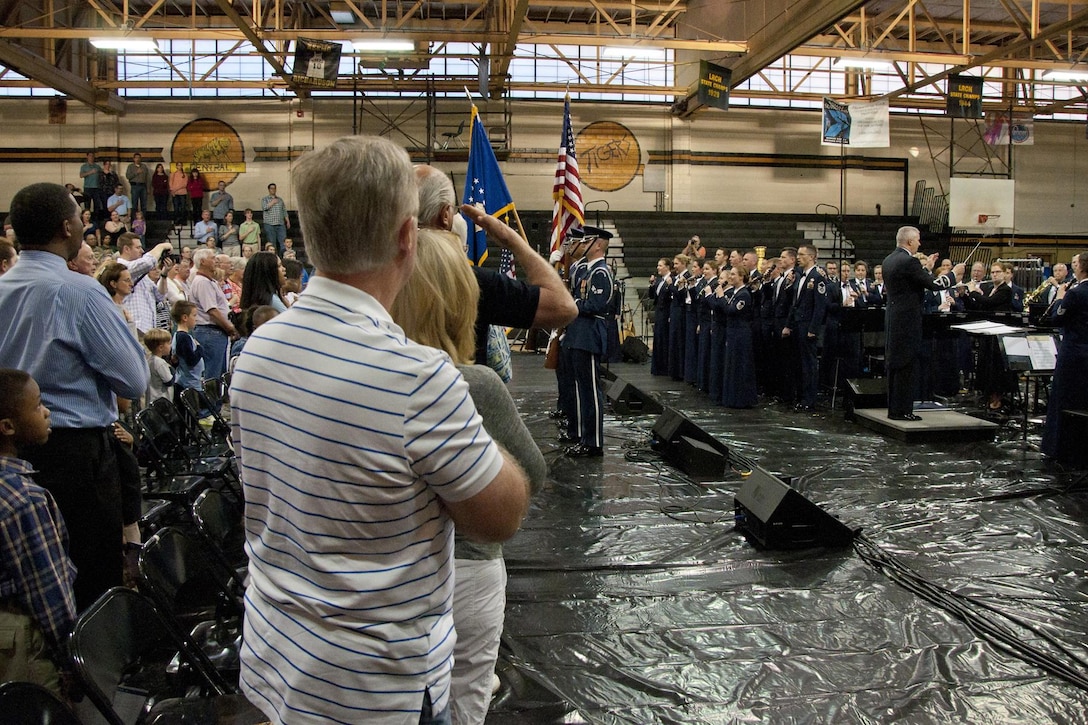 The United States Air Force Concert Band and the U.S. Air Force Singing Sergeants, perform the National Anthem at Little Rock Central High School, in Little Rock, Ark., Apr. 7, 2016. The concert was one way for the Air Force to give back to the local community and thank them for supporting Little Rock Air Force Base. (Courtesy photo by Eva Walston/Released)