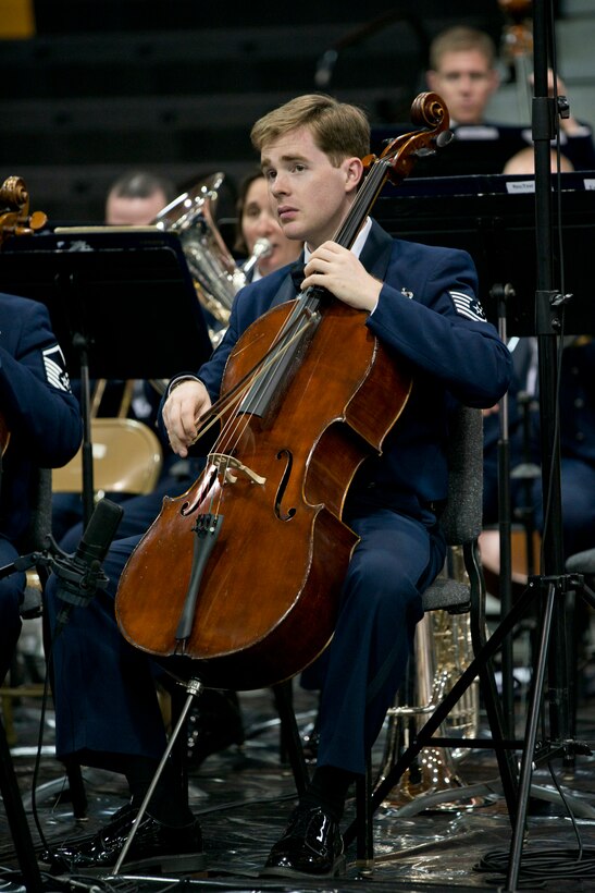 U.S. Air Force Tech. Sgt. Edward Prevost, U.S. Air Force Concert Band cellist, plays the cello during a Concert Band and Singing Sergeants performance at Little Rock Central High School, in Little Rock, Ark., Apr. 7, 2016. The Concert Band and Singing Sergeants are performing across five states during a 12-day spring tour. (U.S. Air Force photo by Capt. Casey Staheli/Released)