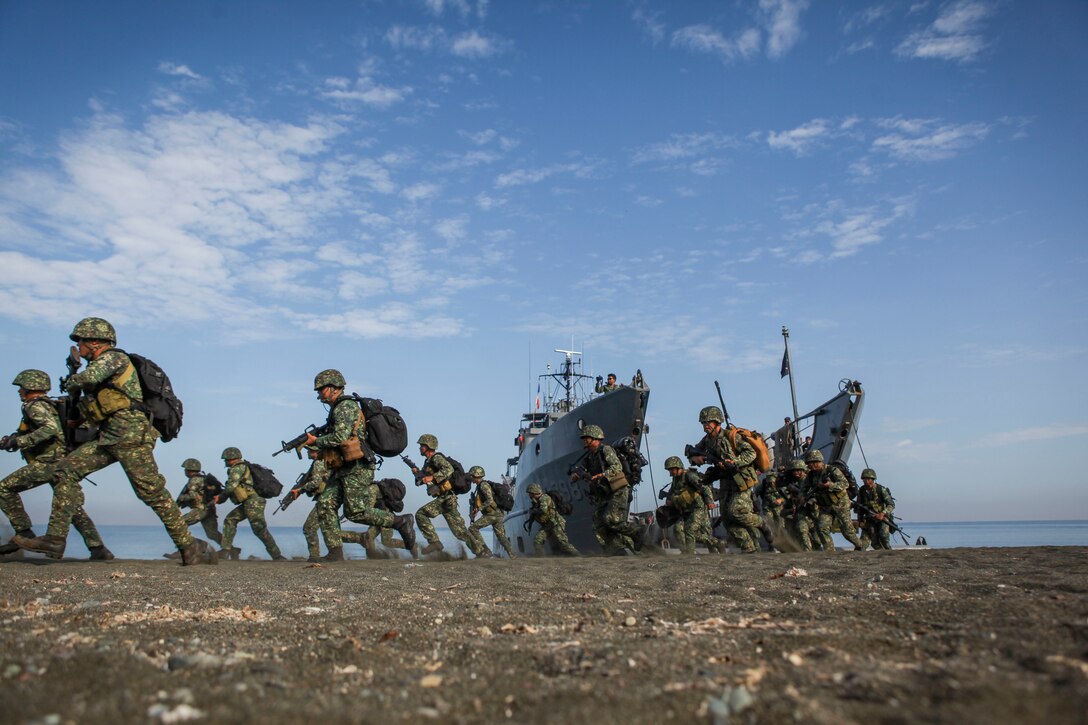 Philippine marines with the Joint Rapid Reaction Force (JRRF), conduct an amphibious landing utilizing Philippine logistical navy ships to seize a scenario-based objective as part of Exercise Balikatan 2016, in Antique, Philippines, April 11, 2016. The JRRF, compiled of U.S. and Philippine forces, have worked together during the exercise to test their capabilities, maintain a high level of interoperability and to enhance combined combat readiness. Balikatan, which means "shoulder to shoulder" in Filipino, is an annual bilateral training exercise aimed at improving the ability of Philippine and U.S. military forces to work together during planning, contingency and humanitarian assistance and disaster relief operations.