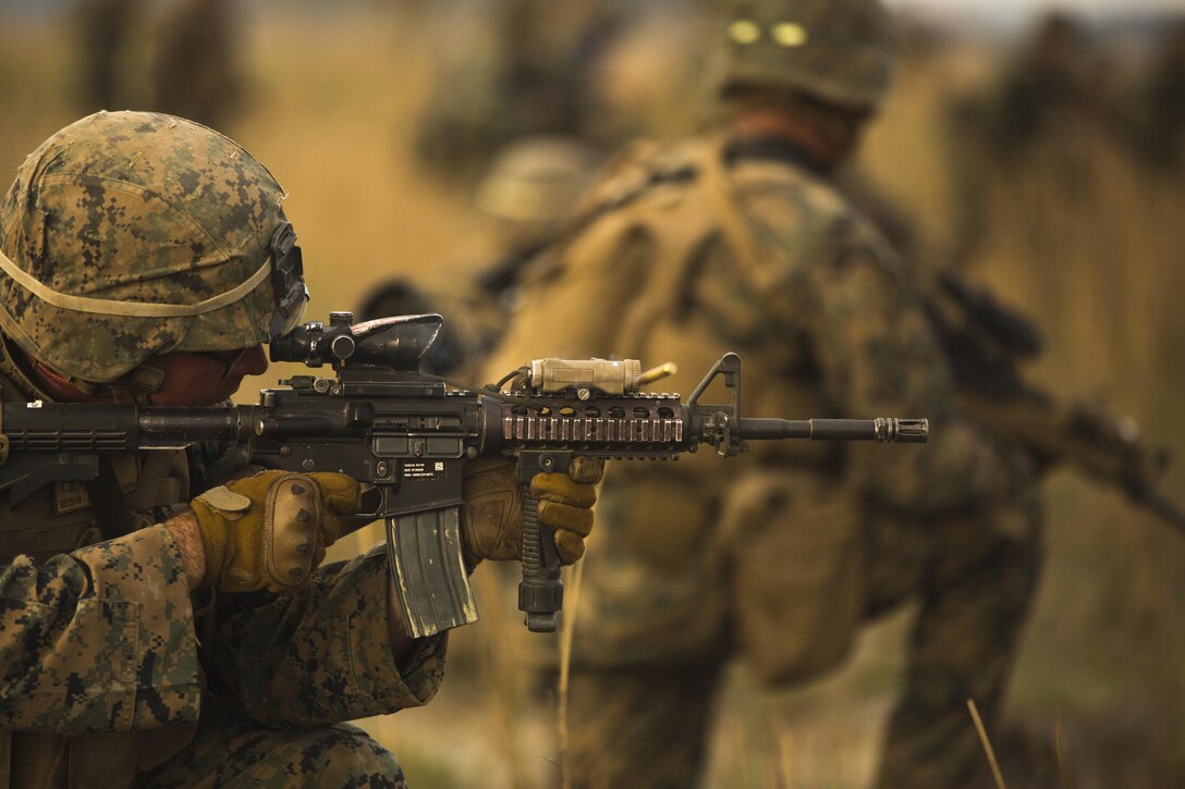 U.S. Marine Lance Cpl. Dillon Ellzey, squad leader with Fox Company, 2nd Battalion, 2nd Marine Regiment, 2nd Marine Division currently assigned to 3rd Marine Division, III Marine Expeditionary Force under the Unit Deployment Program conducts a ground assault maneuver training during Balikatan 16 at Crow Valley, Philippines, April 9, 2016. U.S. and Philippine Marines trained “shoulder-to-shoulder” after an aerial insert in ground assault maneuvers to build their combined capabilities. Balikatan is an annual Philippines-U.S. military bilateral training exercise that strengthens the Philippine-U.S. alliance and focuses on a variety of missions in response to conflict and crises throughout the Indo-Asia-Pacific region. (U.S. Marine Corps photo by Lance Cpl. Cameron Darrough/Released)