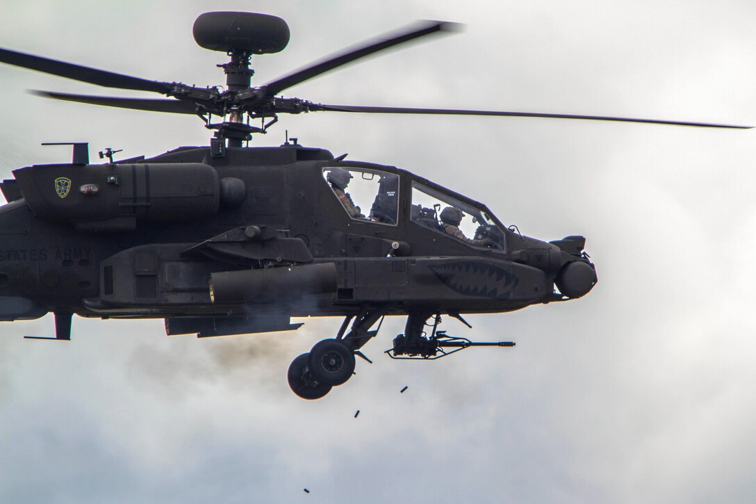 An AH-64E Apache helicopter fires its M-230 chain gun during a combined arms live-fire exercise at Joint Base Lewis-McChord, Wash., April 5, 2016. Army photo by Capt. Brian H. Harris