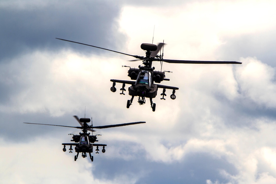 Two AH-64E Apache helicopters pass overhead during a combined arms live-fire exercise at Joint Base Lewis-McChord, Wash., April 5, 2016. Army photo by Capt. Brian H. Harris