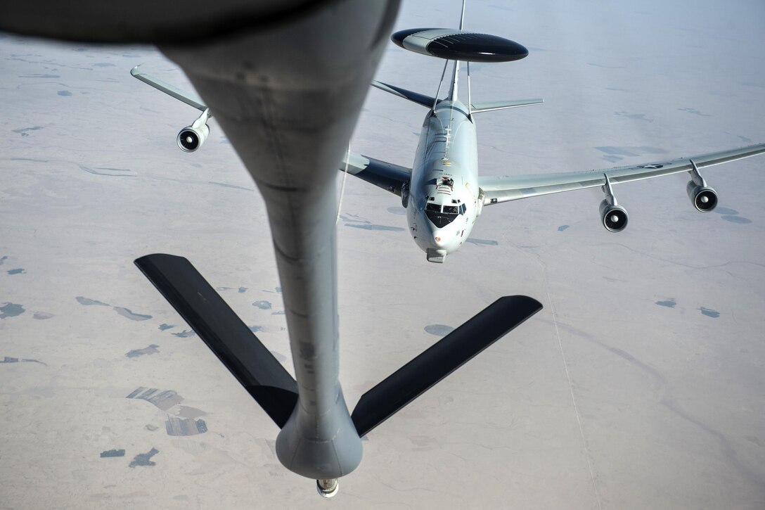 An Air Force E-3 Sentry, airborne warning and control system aircraft, approaches an Air Force KC-135 Stratotanker refueler aircraft over Iraq, April 5, 2016, in support of Operation Inherent Resolve. Air Force photo by Staff Sgt. Corey Hook