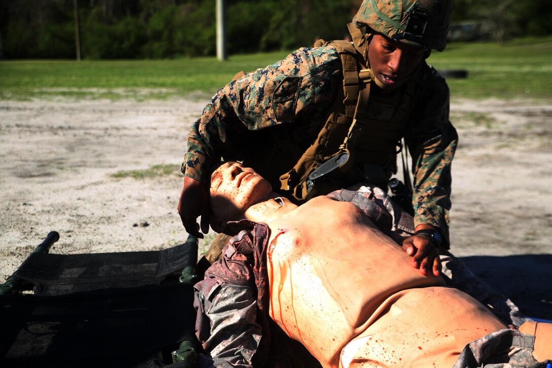 A scout with 2nd Light Armored Reconnaissance Battalion demonstrates his abilities in combat lifesaver skills during the battalion’s annual Isaak Competition at Camp Lejeune, N.C., April 4, 2016. The competition offered the scouts a plethora of different scenarios a scout must be able to accomplish, including casualty evacuation, call for fire, unknown-distance marksmanship, and land navigation. (U.S. Marine Corps photo by Cpl. Joey Mendez)