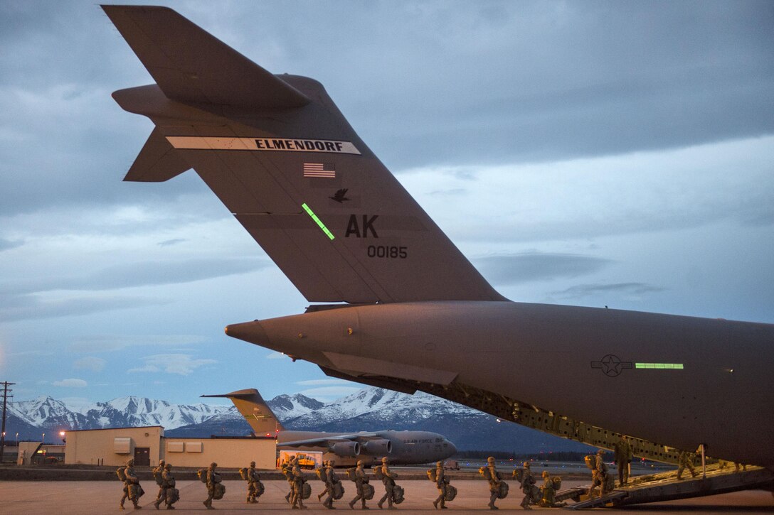 Paratroopers board a C-17 Globemaster III aircraft during a night jump exercise at Malemute drop zone, Joint Base Elmendorf-Richardson, March 31, 2016. Air Force photo by Senior Airman James Richardson