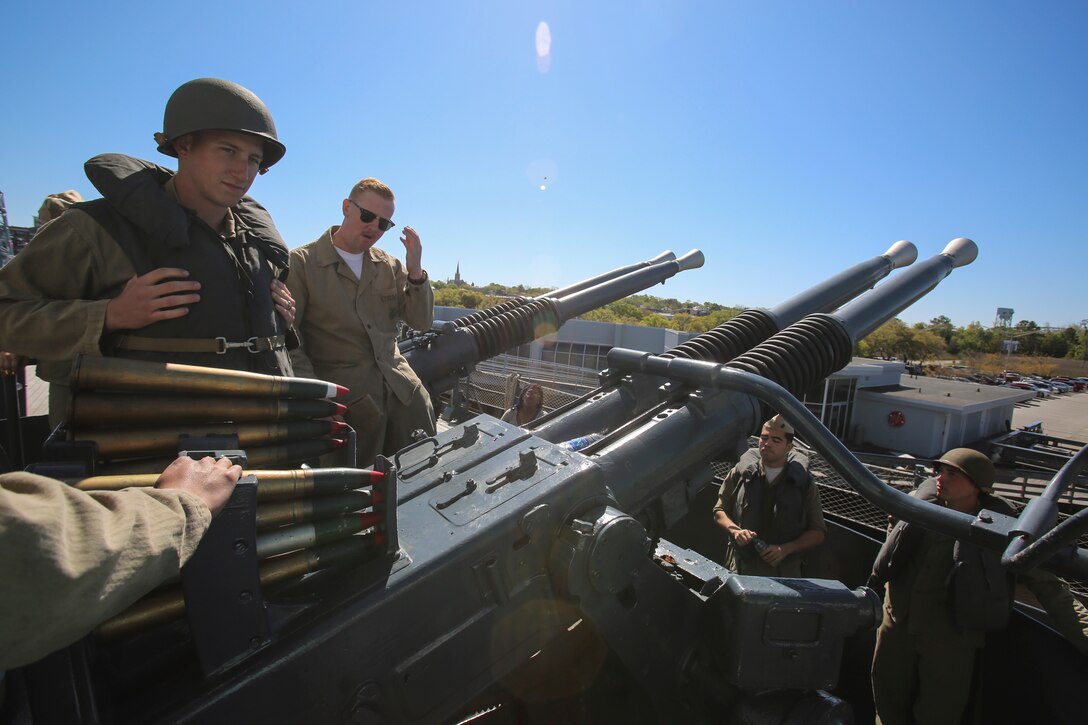 Marines with 2nd Tank Battalion demonstrate how to operate the 40mm/.56 caliber guns during the USS North Carolina (BB-52) Battleship’s 75th anniversary of its commissioning in Wilmington, N.C., April 9, 2016. As part of the celebration, Marines and sailors from 2nd Tank Bn. and other 2nd Marine Division units showcased how different parts of the ship operated by role-playing throughout rooms of the USS North Carolina (BB-52). (U.S. Marine Corps photo by LCpl. Miranda Faughn/Released)