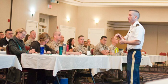 Maj. Jeremy Kerfoot, U.S. Army Military Police Sexual Assault Prevention and Response Office, lectures on the topic of Organizational Prevention during the 2nd annual Sexual Harassment/Assault Response and Prevention Symposium hosted by the Sexual Assault Prevention Response Office (SAPRO) at The Clubs at Quantico aboard Marine Corps Base Quantico.