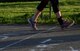 A member of Team Barksdale crosses the finish line during the Helping Agency 5K on Barksdale Air Force Base, La., April 8, 2016. The 5K was held to promote awareness for Air Force helping agencies and awareness campaigns. (U.S. Air Force photo/Senior Airman Jannelle Dickey)