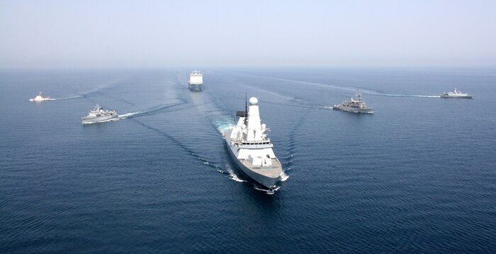 (April 11, 2016) Royal Navy ship HMS Defender and Royal Fleet Auxiliary ship RFA Cardigan Bay anchor a formation of coalition mine countermeasures and maritime security vessels at sea, operating in support of the International Mine Countermeasures Exercise (IMCMEX). IMCMEX includes navies from more than 30 countries spanning six continents training together across the Middle East. The exercise is focused on maritime security from mine countermeasures, maritime infrastructure protection and maritime security operations in support of civilian shipping.