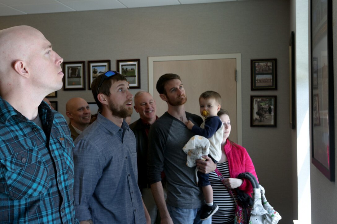 Corporal David Hudson, Lance Ronevich and Matthew Strong, veterans of 1st Battalion, 2nd Marine Regiment, tour the Helmand conference room in the 1/2 headquarters building on Camp Lejeune, N.C., April 9, 2016. Hudson was one of the contributors to the room along with Sgt. Jordan Malone and Sgt. Matteo Marshall. (U.S. Marine Corps photo by Cpl. Melodie Snarr/Released)