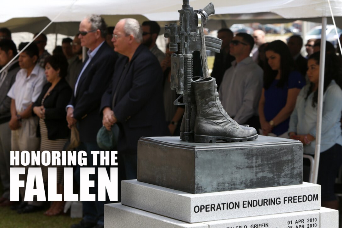 Veterans, family members and friends stand in a moment of silence for all the fallen Marines of 1st Battalion, 2nd Marine Regiment during a memorial ceremony held at the battalion headquarters building on Camp Lejeune, N.C., April 9, 2016. The ceremony focused on the 2010 Afghanistan deployment but was open to all veterans of 1/2 in order to build a network of friends for the veterans to rely on. (U.S. Marine Corps photo illustration by Cpl. Melodie Snarr/Released)
