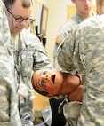 U.S. Army Reserve Soldiers with the 399th Combat Support Hospital, 804th Medical Brigade, 3d Medical Command (Deployment Support), performs a physical assessment on a simulated casualty during an exercise held April 2, 2016 at the Mayo Clinic Multidisciplinary Simulation Center in Rochester, Minnesota. During the exercise, the unit implemented the Team Strategies and Tools to Enhance Performance and Patient Safety, or TeamSTEPPS, model of patient care. The model serves as a framework to optimize team performance across the health care delivery system.