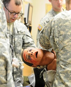 U.S. Army Reserve Soldiers with the 399th Combat Support Hospital, 804th Medical Brigade, 3d Medical Command (Deployment Support), performs a physical assessment on a simulated casualty during an exercise held April 2, 2016 at the Mayo Clinic Multidisciplinary Simulation Center in Rochester, Minnesota. During the exercise, the unit implemented the Team Strategies and Tools to Enhance Performance and Patient Safety, or TeamSTEPPS, model of patient care. The model serves as a framework to optimize team performance across the health care delivery system.