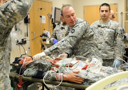 U.S. Army Reserve 1st Lt. John Gotta, a South Kingstown, Rhode Island native and emergency room nurse with the 399th Combat Support Hospital, 804th Medical Brigade, 3d Medical Command (Deployment Support) makes sure it is clear before delivering a shock to a simulated casualty during an exercise held April 2, 2016 at the Mayo Clinic Multidisciplinary Simulation Center in Rochester, Minnesota. The purpose of the exercise was for the 399th CSH Soldiers to practice the Department of the Defense mandated framework known as Team Strategies and Tools to Enhance Performance and Patient Safety, or TeamSTEPPS. TeamSTEPPS optimizes military medical care by focusing on reducing communication errors that can lead to improper patient care.