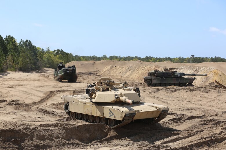 Marines with 2nd Assault Amphibian Battalion, and 2nd Tank Battalion, 2nd Marine Division provide support for the Marines of 2nd Combat Engineer Battalion, allowing the engineers to work in conjunction with units that they would support in a real combat situation during their annual Marine Corps Combat Readiness Evaluation on Camp Lejeune, N.C., April 4-8, 2016.The engineers provided route clearance for various vehicular support during the exercise to help portray a situation they could encounter. (U.S. Marine Corps photo by Cpl. Shannon Kroening/ Released)