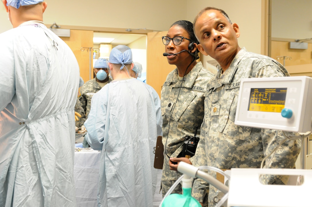 U.S. Army Reserve Soldiers operating as observer-controller/trainers with the Medical Readiness and Training Command, Army Reserve Medical Command observes as U.S. Army Reserve Soldiers from the 399th Combat Support Hospital, 804th Medical Brigade, 3d Medical Command (Deployment Support) conduct an exercise April 2, 2016 at the Mayo Clinic Multidisciplinary Simulation Center in Rochester, Minn. During the exercise, the OC/Ts monitored and evaluated the unit's performance as they navigated the scenarios laid out for them. The purpose of the exercise was for the 399th CSH Soldiers to practice the Department of the Defense mandated framework known as Team Strategies and Tools to Enhance Performance and Patient Safety, or TeamSTEPPS. TeamSTEPPS optimizes military medical care by focusing on reducing communication errors that can lead to improper patient care.