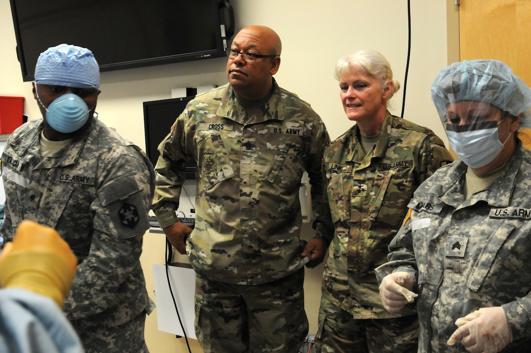 Command Sgt. Maj. Marlo V. Cross, Jr. and Maj. Gen. Mary E. Link, the command team for the Army Reserve Medical Command, observe Soldiers of the 399th Combat Support Hospital, 804th Medical Brigade, 3d Medical Command (Deployment Support) as they conduct an exercise April 2, 2016 at the Mayo Clinic Multidisciplinary Simulation Center in Rochester, Minnesota. The training served as a platform for the unit to practice and implement the Team Strategies and Tools to Enhance Performance and Patient Safety, or TeamSTEPPS, model of patient care. TeamSTEPPS is a framework mandated by the Department of Defense to optimize the performance of military medical teams and reduce communication errors that can lead to improper patient care.