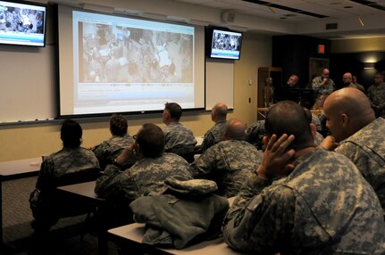 Soldiers from the 399th Combat Support Hospital, 804th Medical Brigade, 3d Medical Command (Deployment Support) watch video footage of their performance during an exercise held April 2, 2016 at the Mayo Clinic Multidisciplinary Simulation Center in Rochester, Minnesota. The unit's every move was recorded at the facility, which allowed them review and improve their performance throughout the course of the exercise. During the exercise, the unit, which is based out of Fort Devens, Massachusetts, practiced the Team Strategies and Tools for Enhanced Performance and Patient Safety, or TeamSTEPPS, model of patient care. TeamSTEPPS is a framework implemented by the Department of Defense to optimize performance of military medical teams and reduce communication errors that can result in improper patient care.