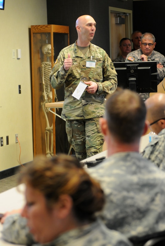 U.S. Army Reserve Col. Todd Traver, the clinical training officer for the Medical Readiness and Training Command out of San Antonio, addresses U.S. Army Reserve Soldiers from the 399th Combat Support Hospital, 804th Medical Brigade, 3d Medical Command (Deployment Support) during an exercise held April 2, 2016 at the Mayo Clinic Multidisciplinary Simulation Center in Rochester, Minnesota. The purpose of the exercise was for the 399th CSH Soldiers to practice the Department of the Defense mandated framework known as Team Strategies and Tools to Enhance Performance and Patient Safety, or TeamSTEPPS. TeamSTEPPS optimizes military medical care by focusing on reducing communication errors that can lead to improper patient care.